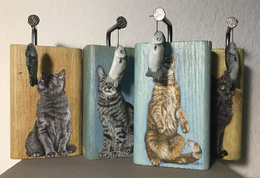 Katzen mit Fischen